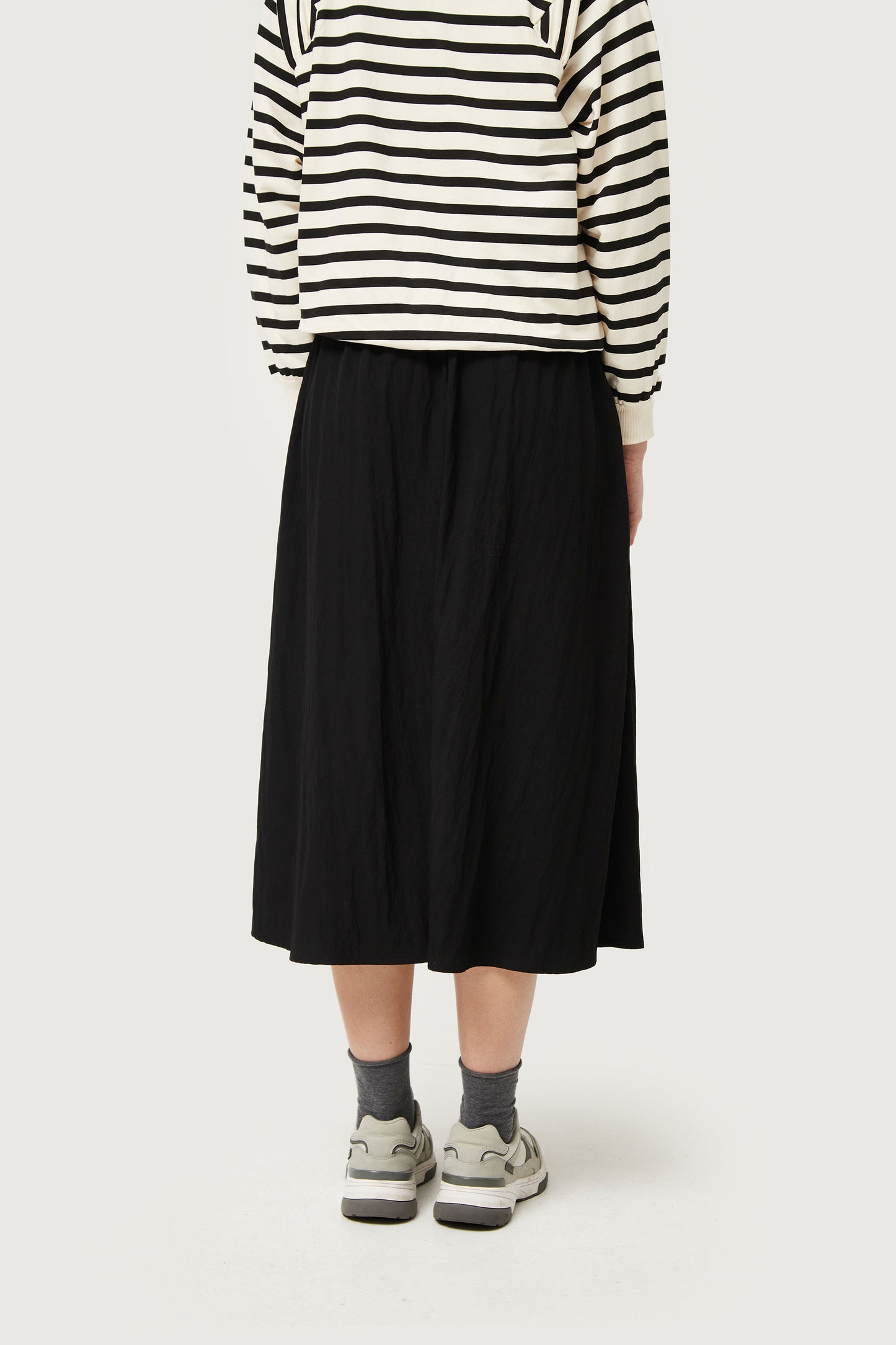 Midi skirt in black technical fabric