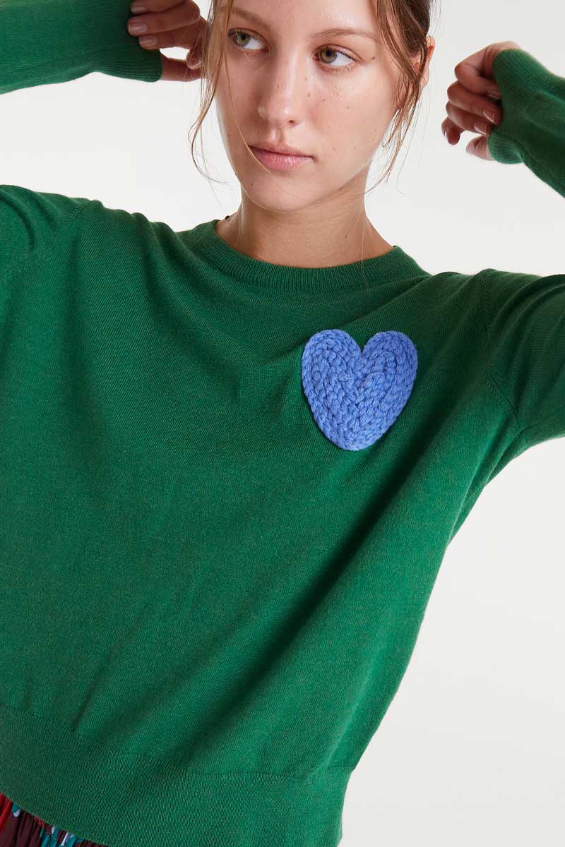Green knitted sweater with heart print