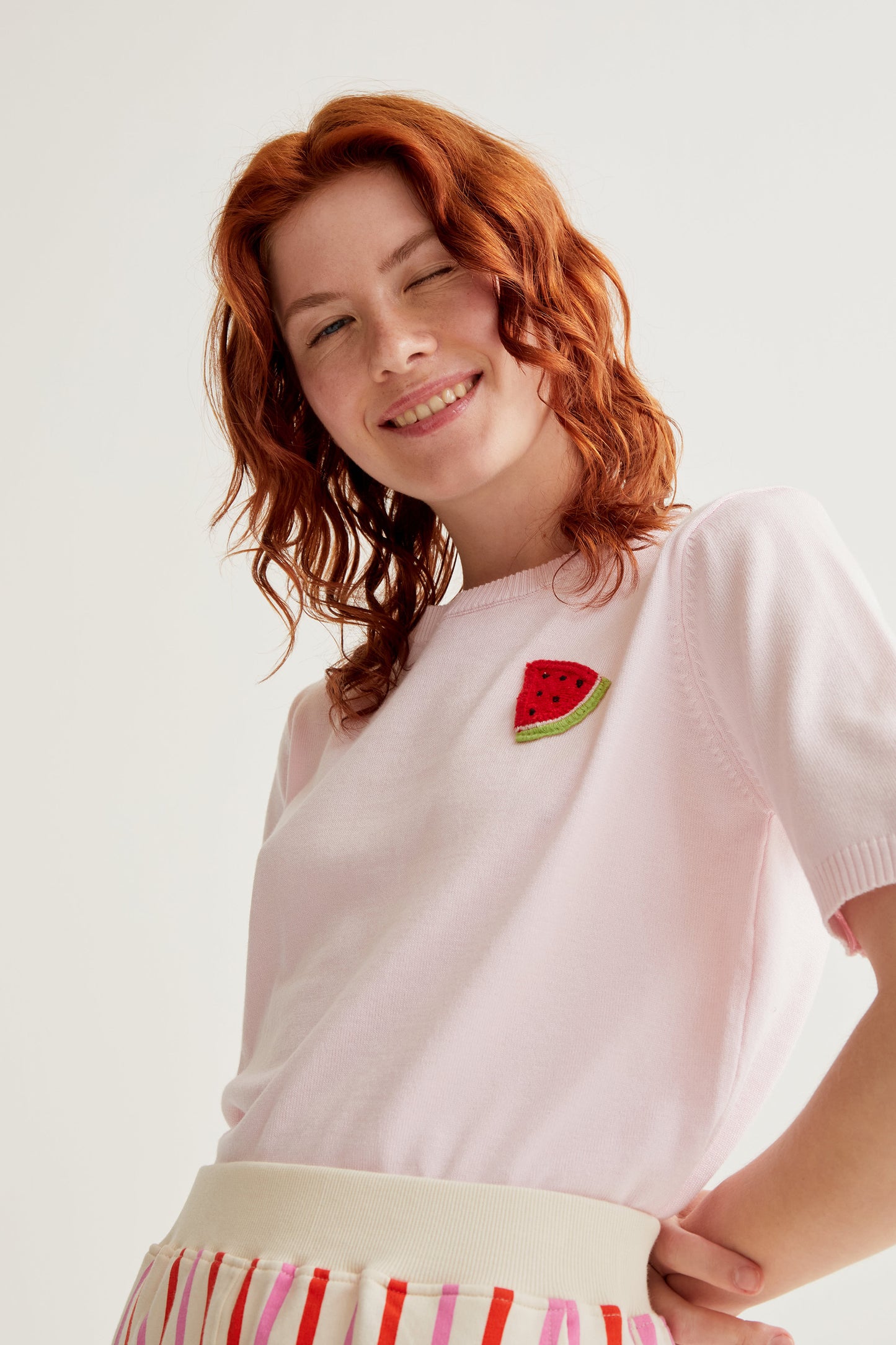 Pink knit top with watermelon embroidery