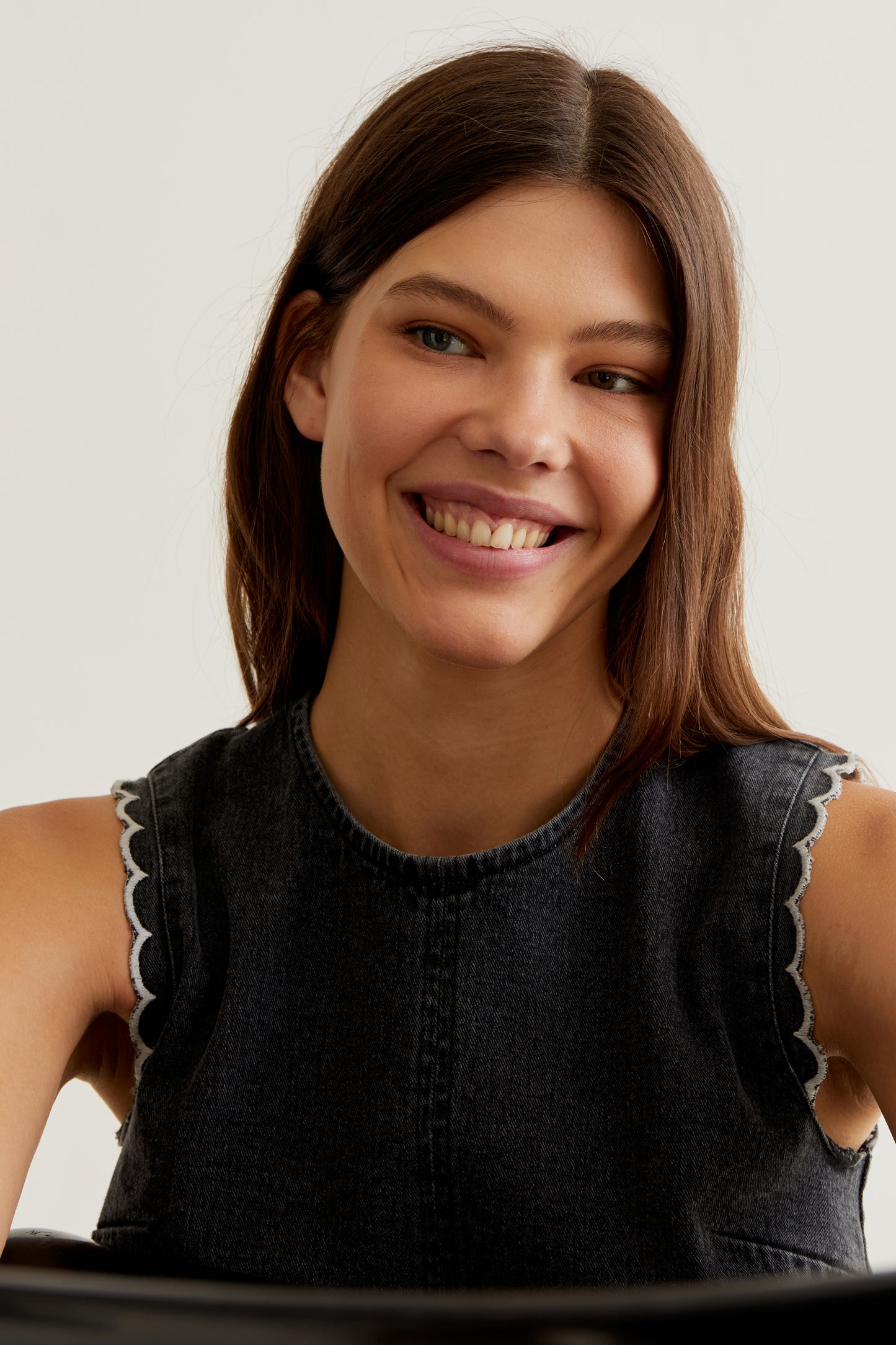 Black denim top with wavy details