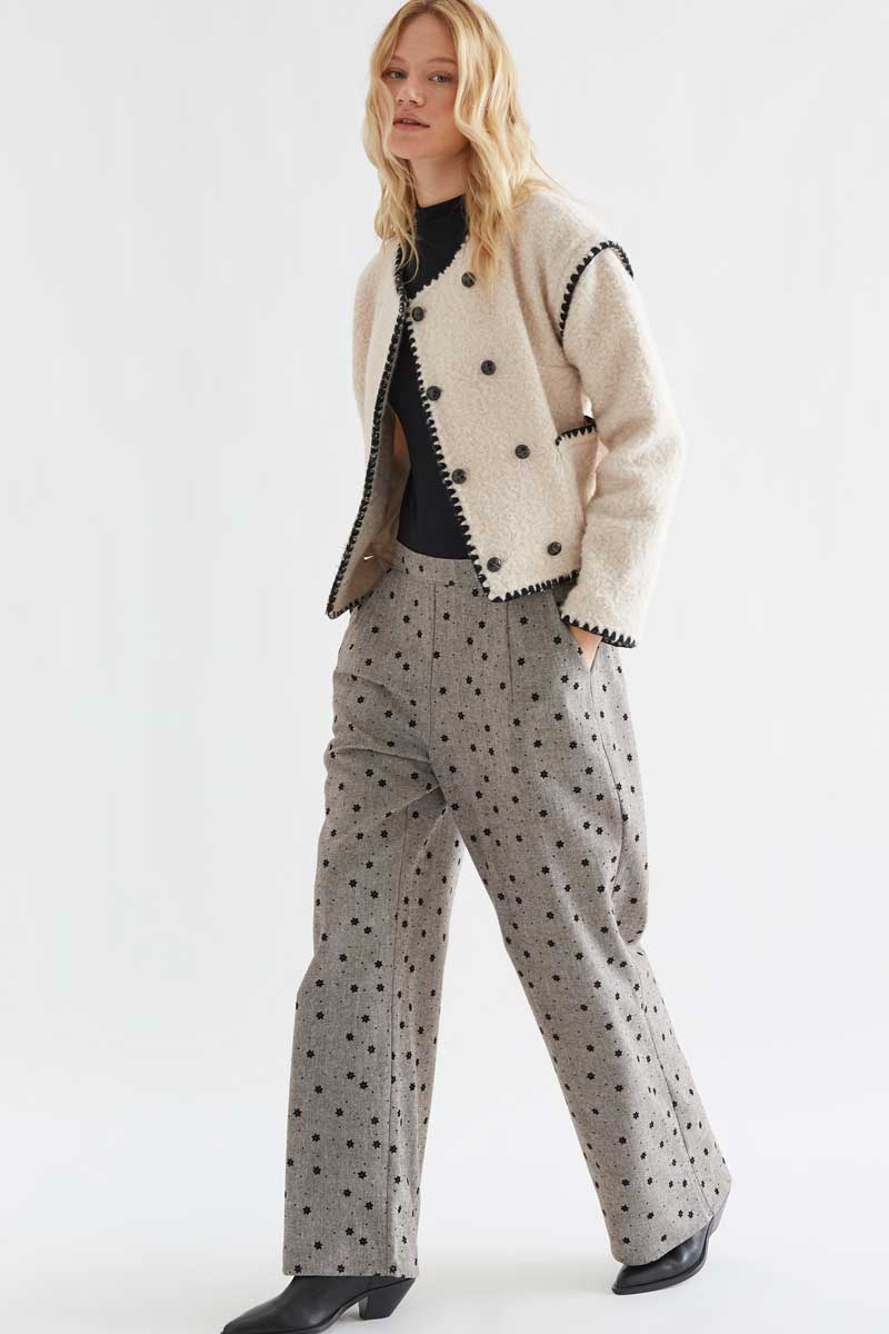 Gray tweed trousers with black embroidered flowers