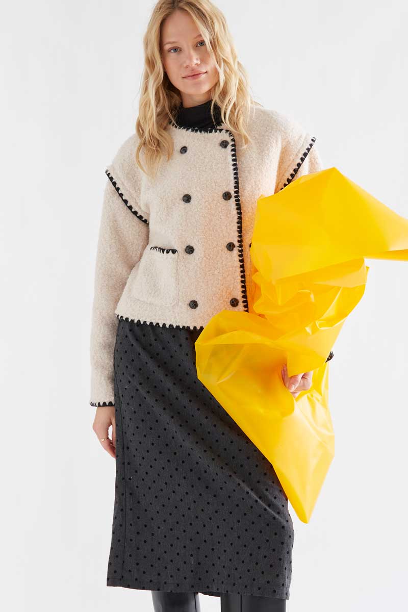 Off-white short faux shearling coat with black accents