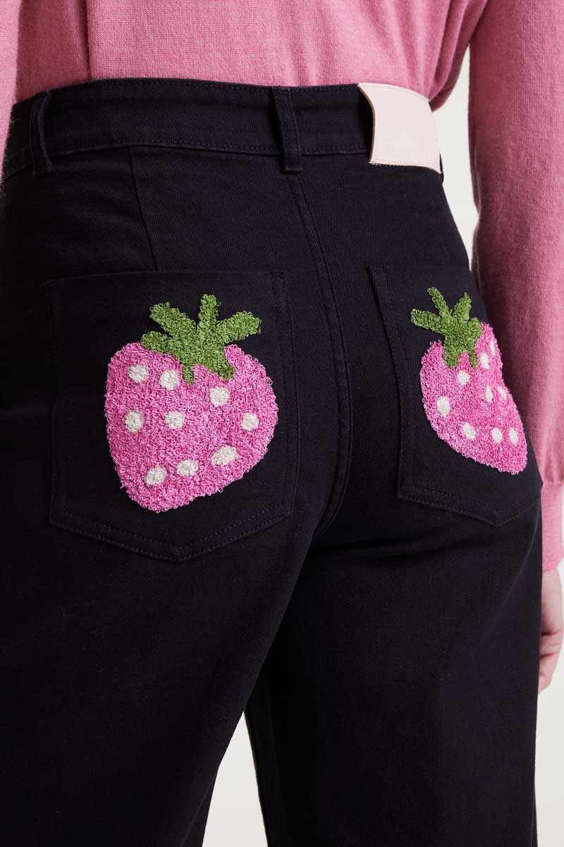 Black jeans with strawberry embroidery