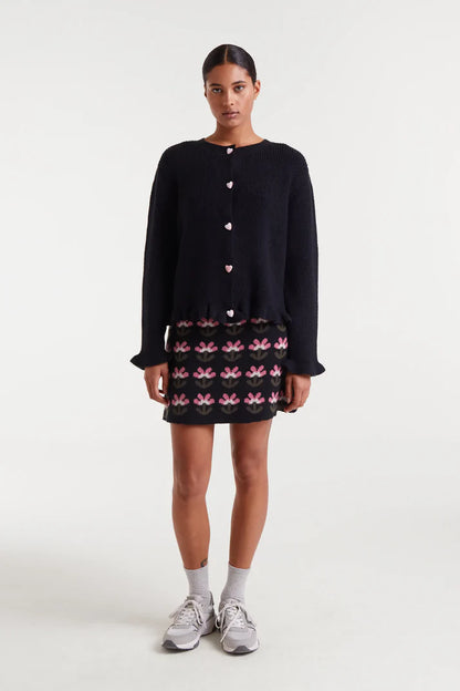 Black knit cardigan with heart detail