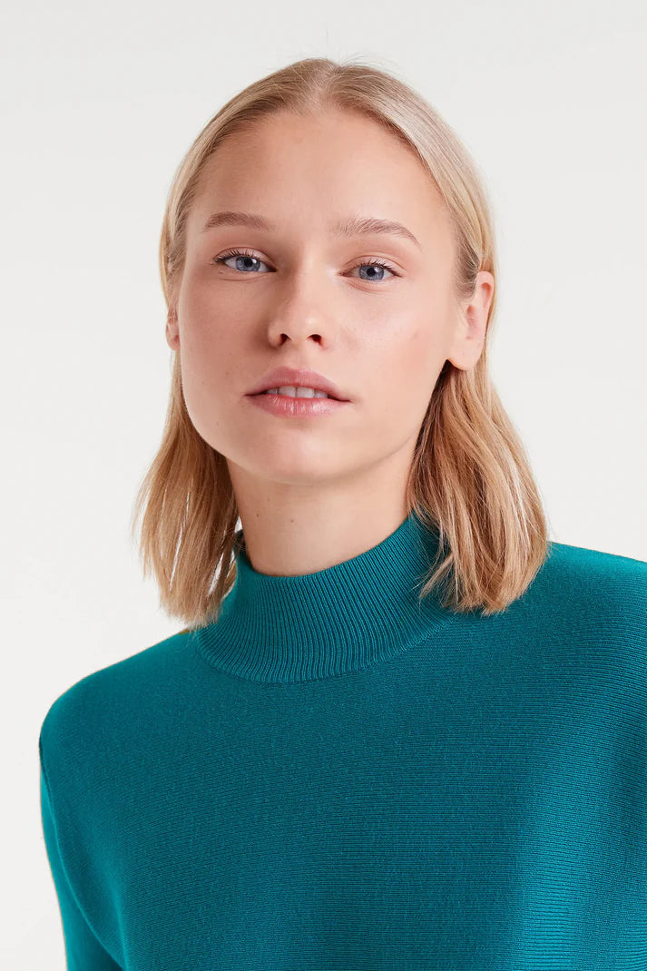 Turquoise flared turtleneck sweater