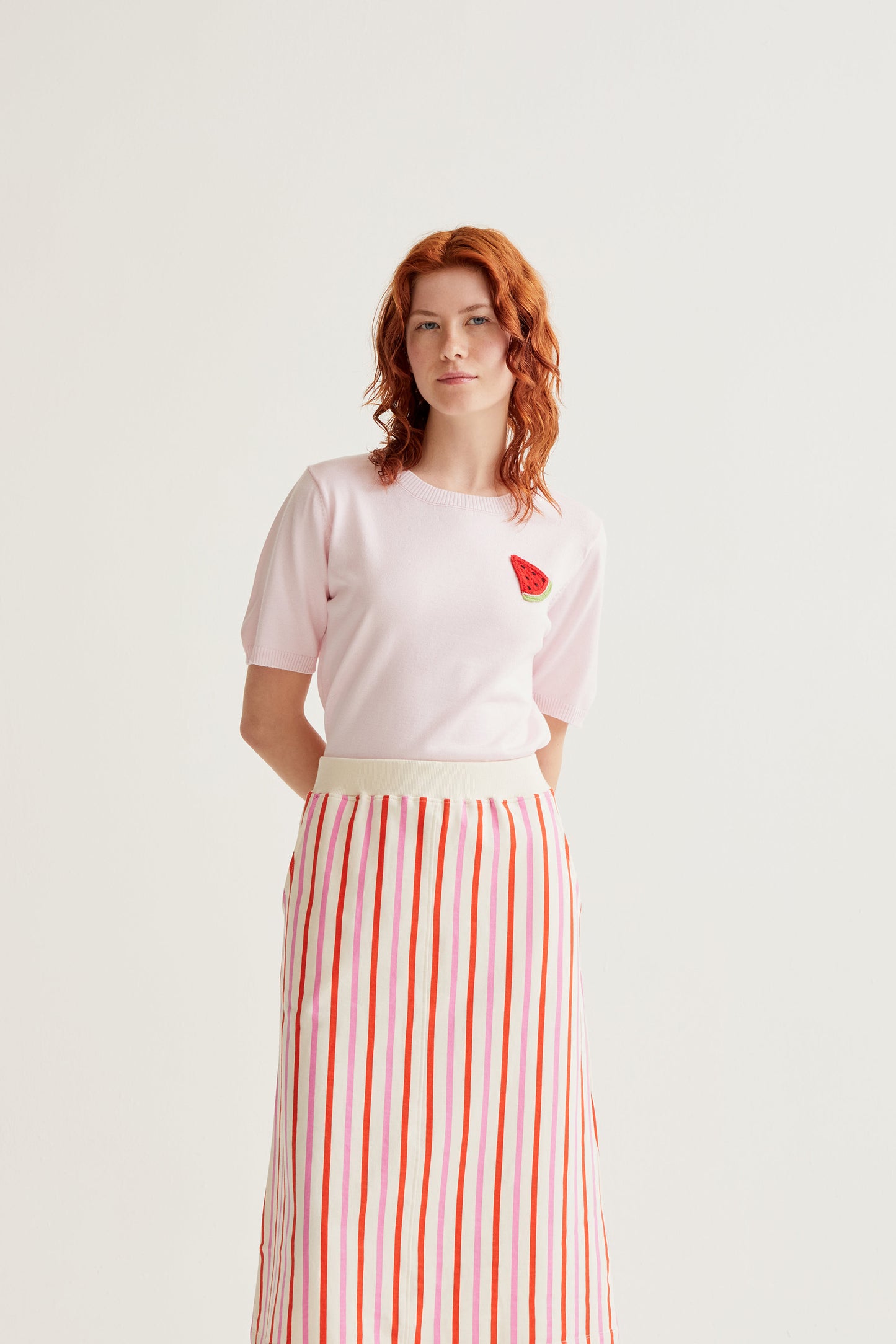 Pink knit top with watermelon embroidery