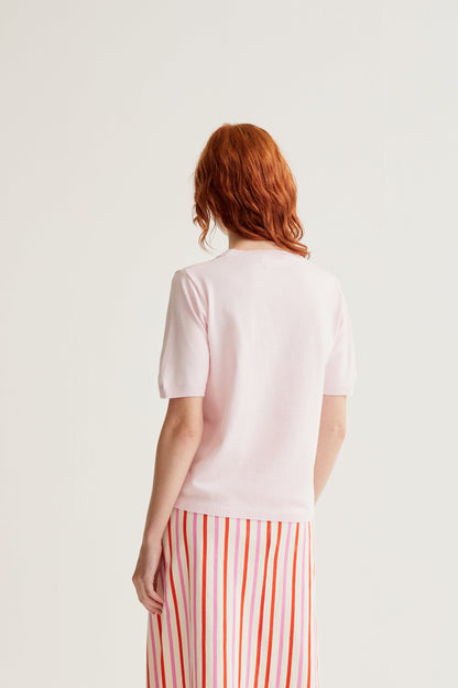 Pink knit top with watermelon embroidery
