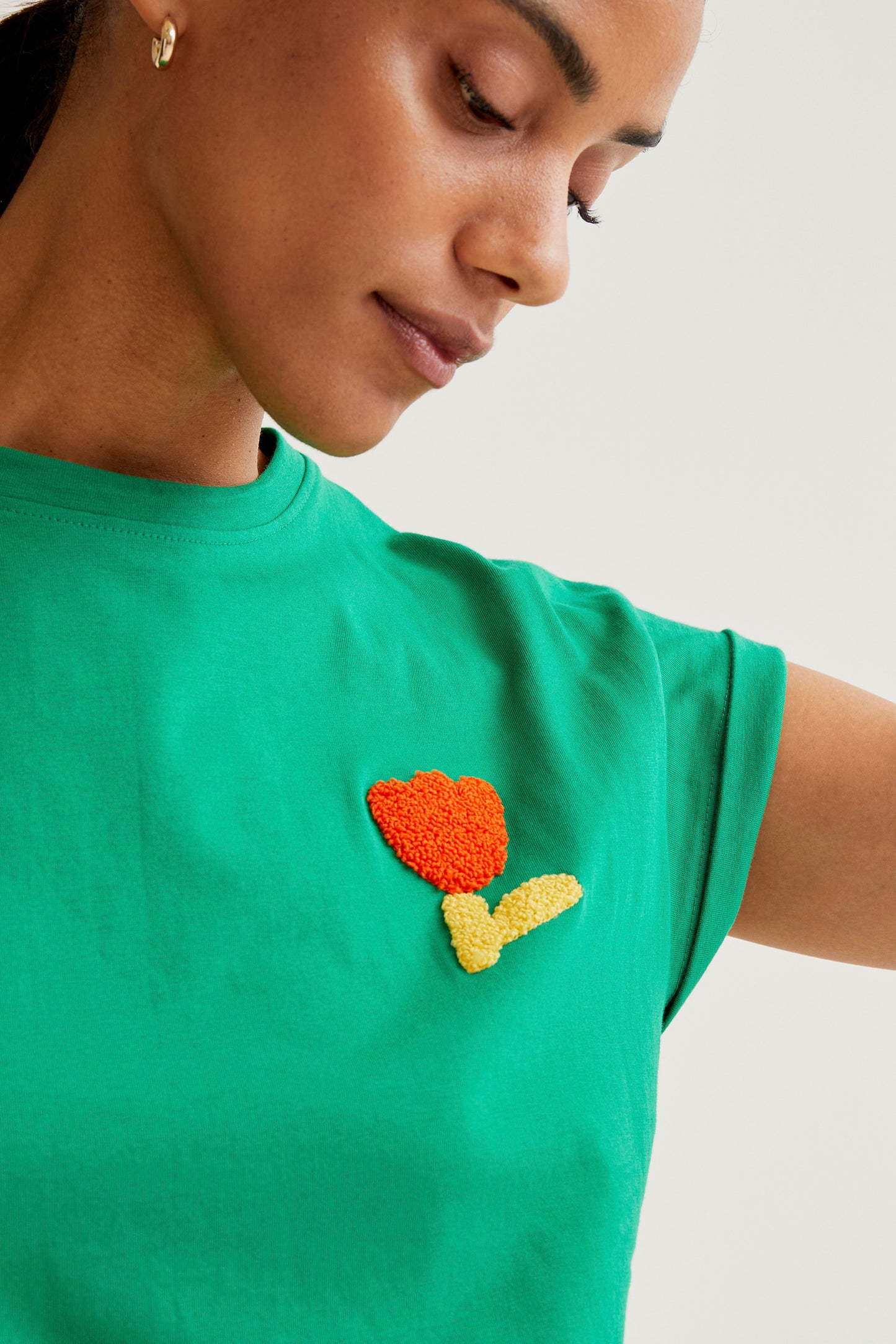 Green t-shirt with red tulip embroidery