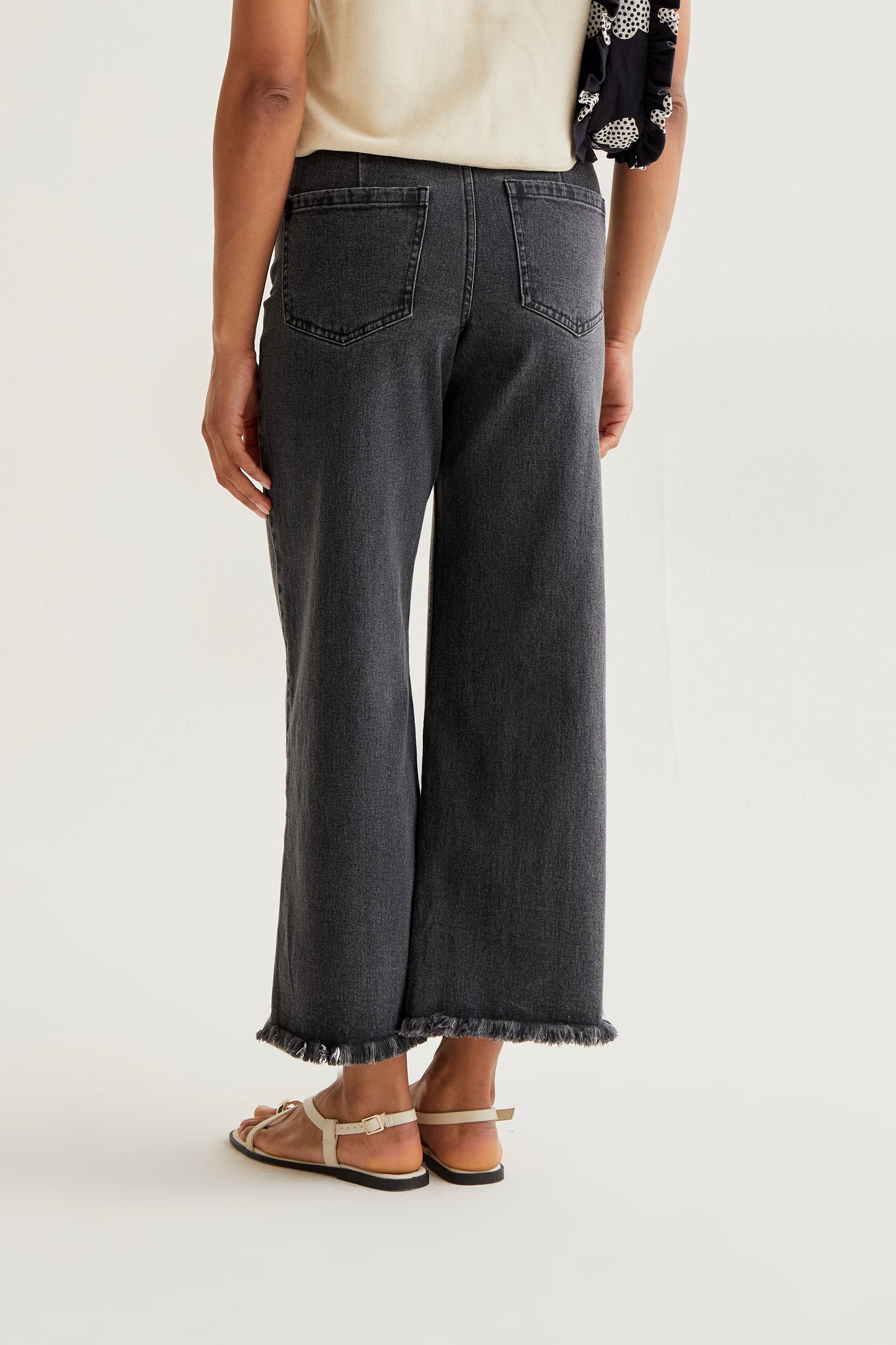 Black jeans with raw-cut hem
