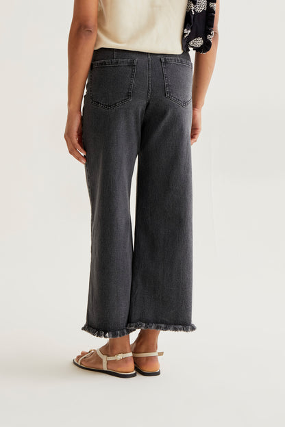 Black jeans with raw-cut hem