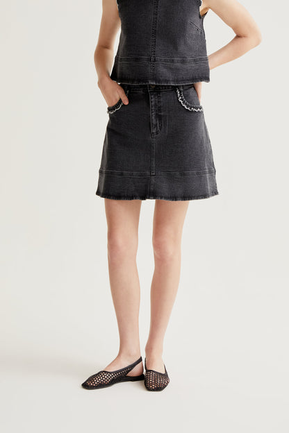 Black denim skirt with ruffle detail