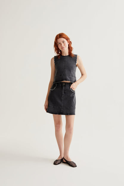 Black denim skirt with ruffle detail