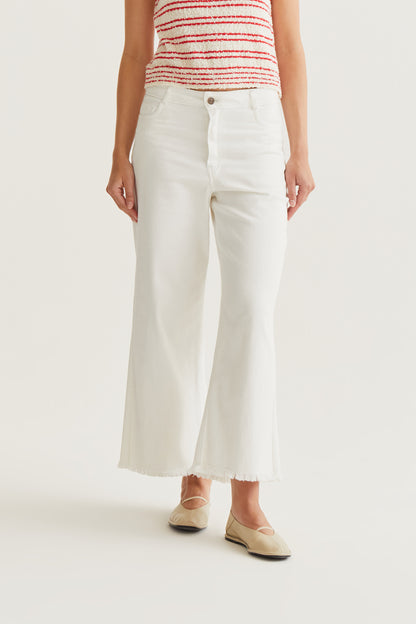 White jeans with raw-cut hem