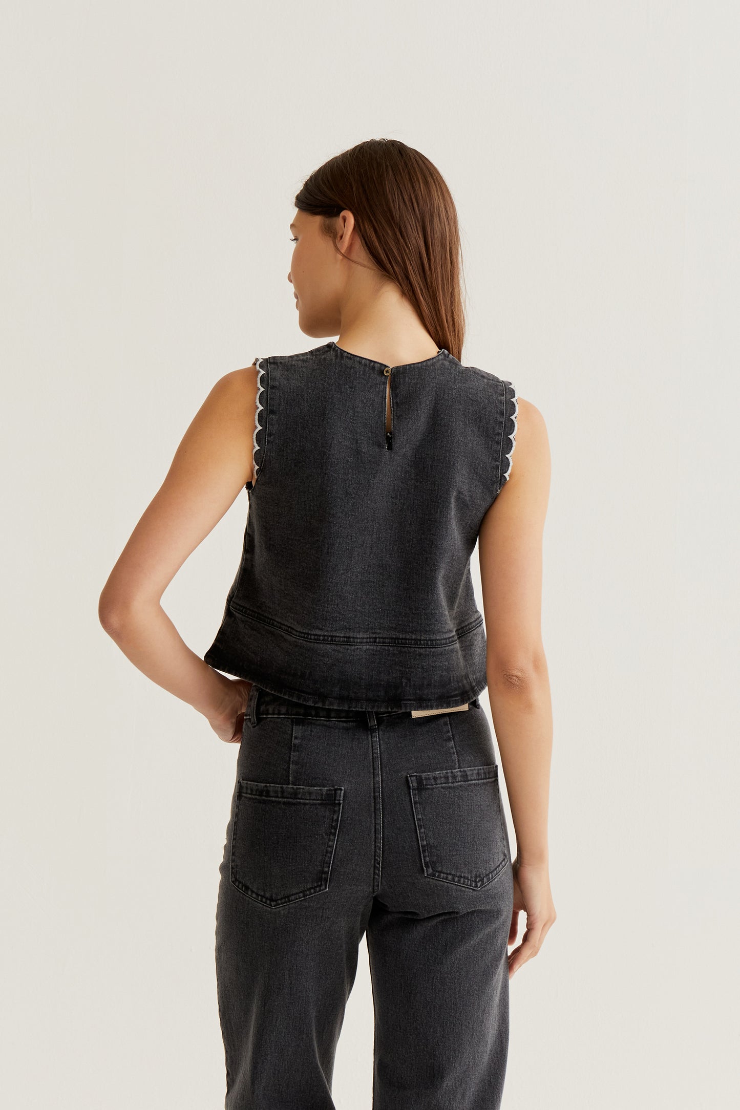 Black denim top with wavy details