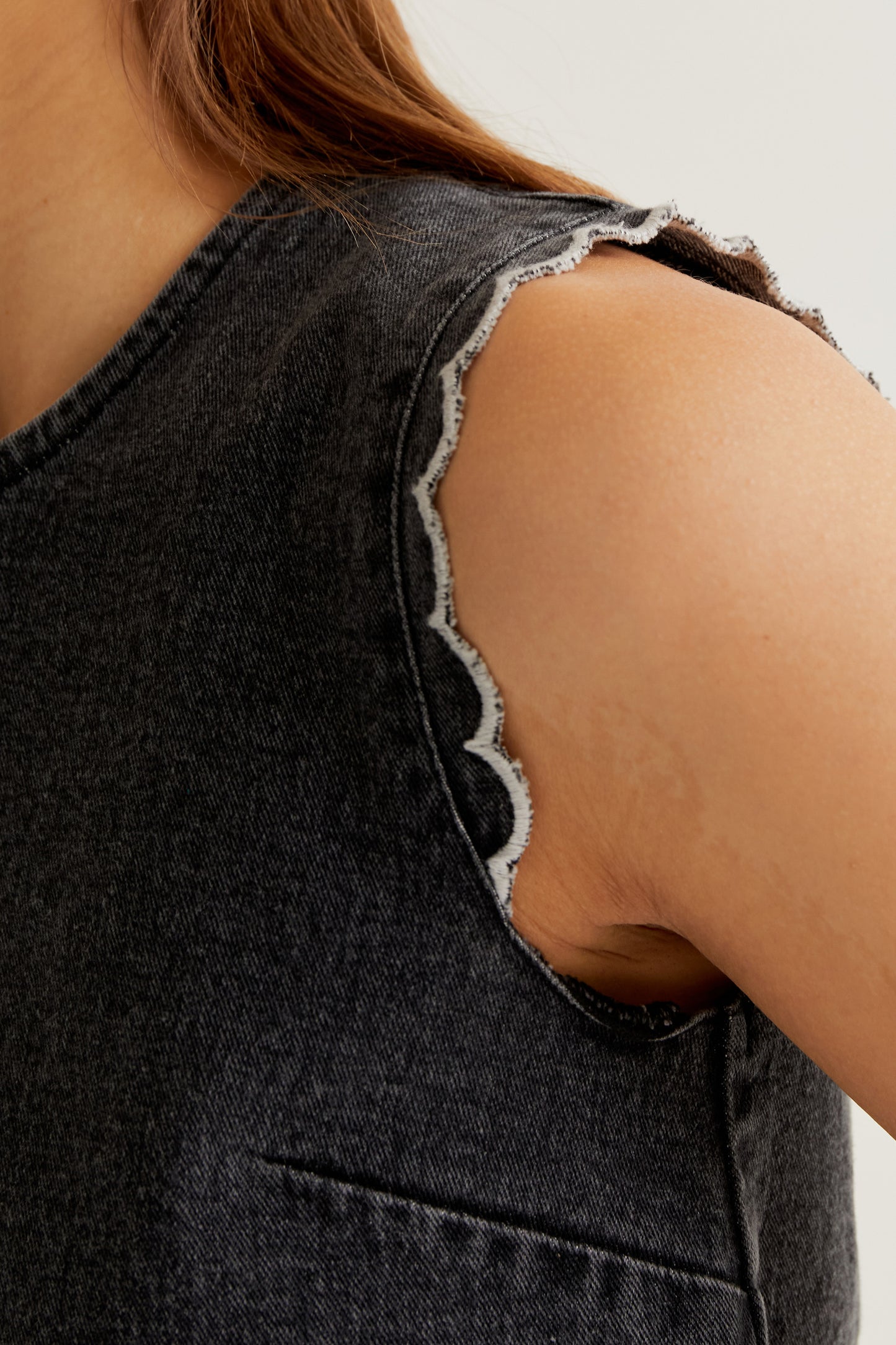 Black denim top with wavy details