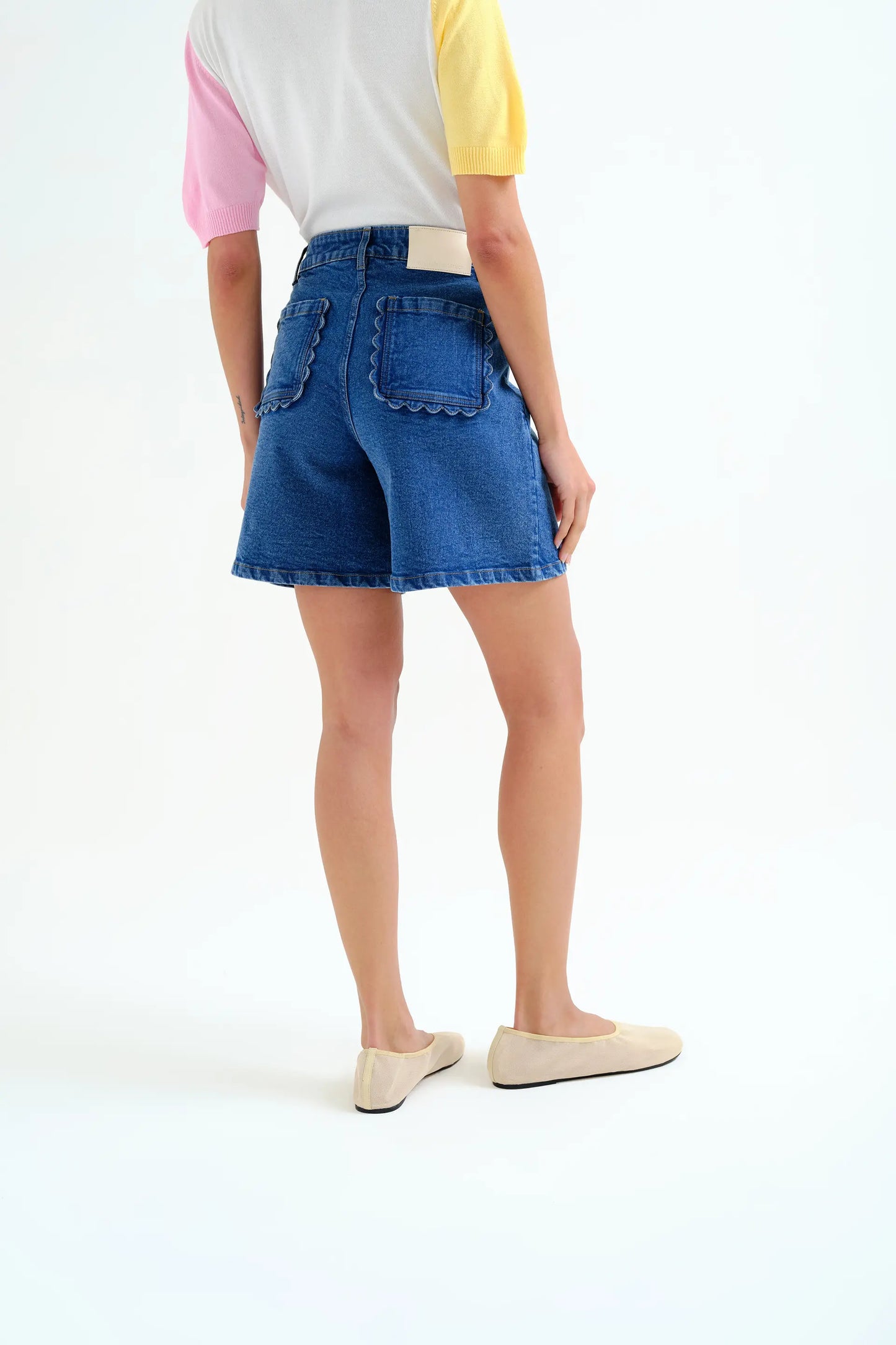 Blue denim shorts with wavy detail