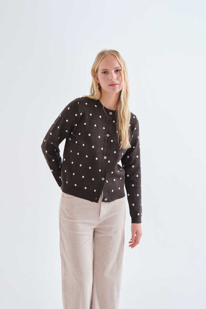 Green cardigan with small white polka dots