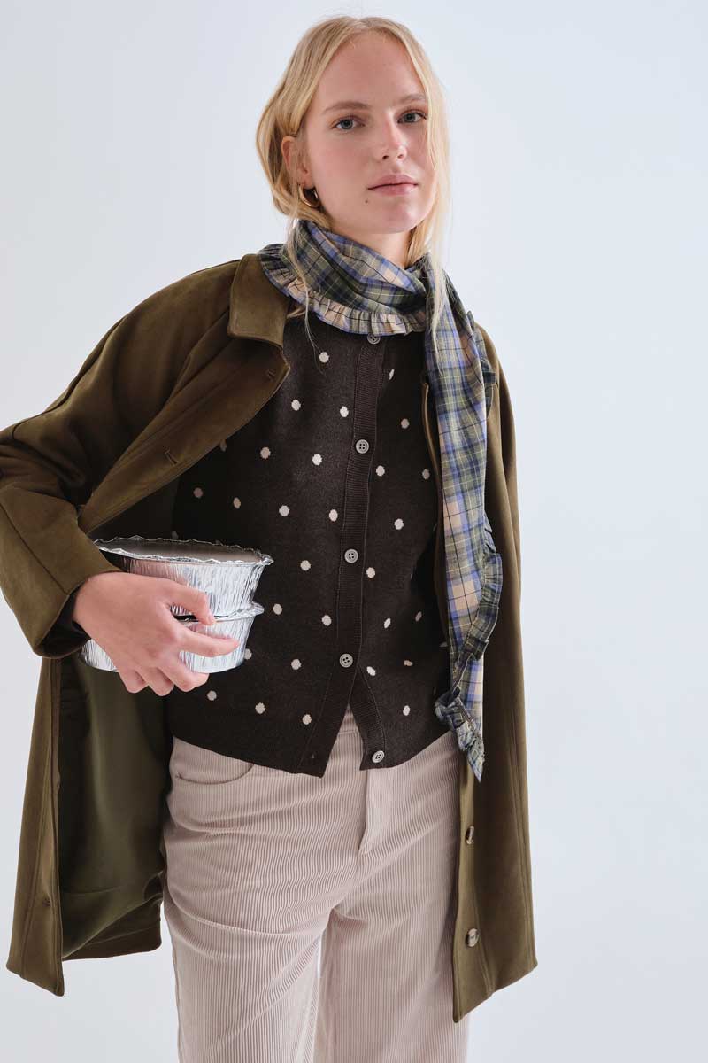 Green cardigan with small white polka dots
