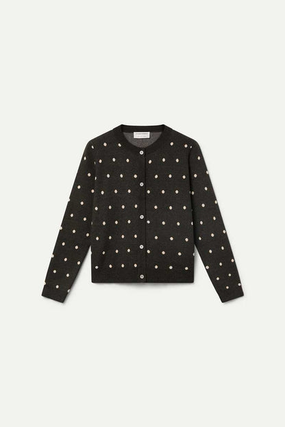 Green cardigan with small white polka dots