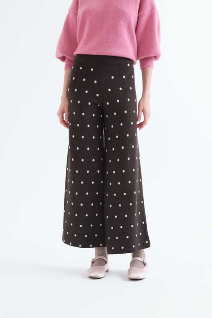 Green pants with small white polka dots