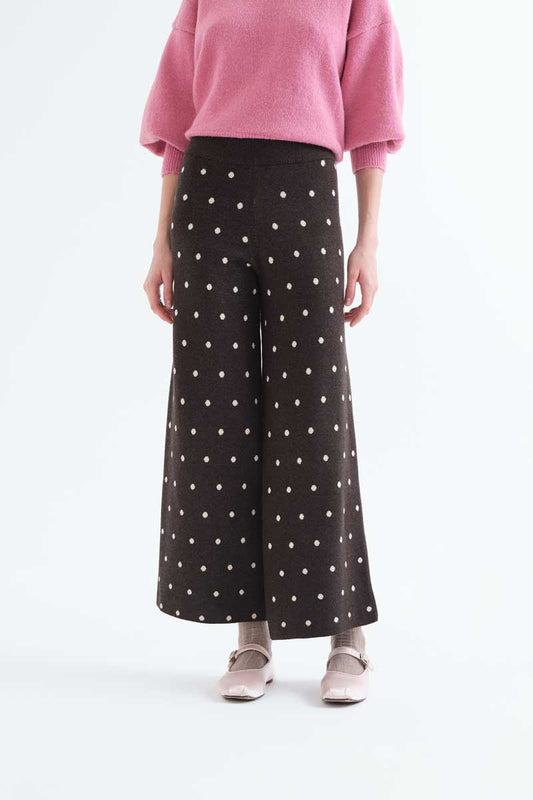 Green pants with small white polka dots