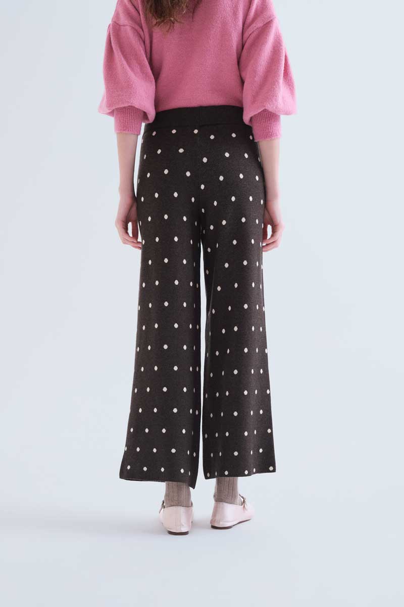 Green pants with small white polka dots