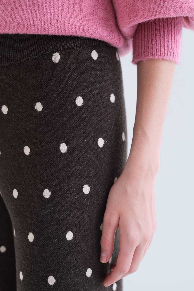 Green pants with small white polka dots