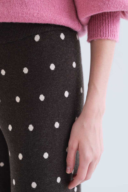 Green pants with small white polka dots