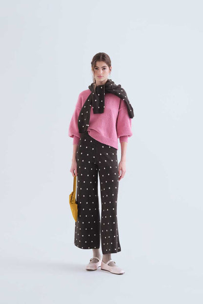 Green pants with small white polka dots
