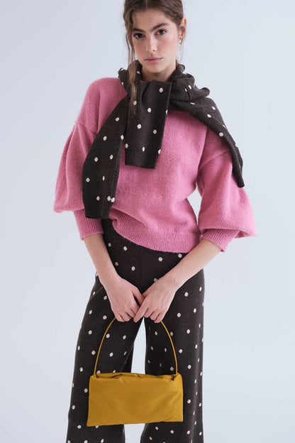 Green pants with small white polka dots