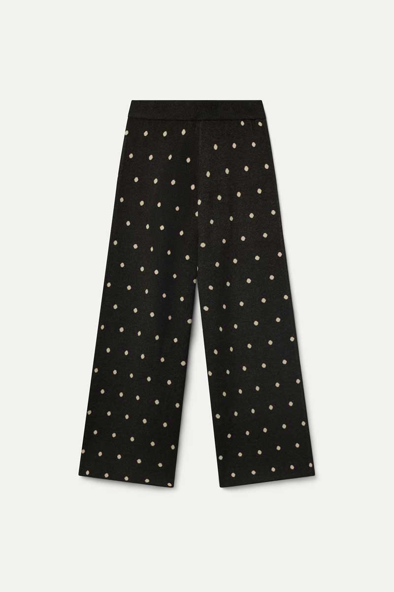 Green pants with small white polka dots