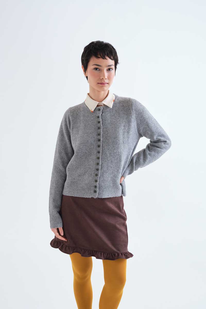 Light grey cardigan with black buttons
