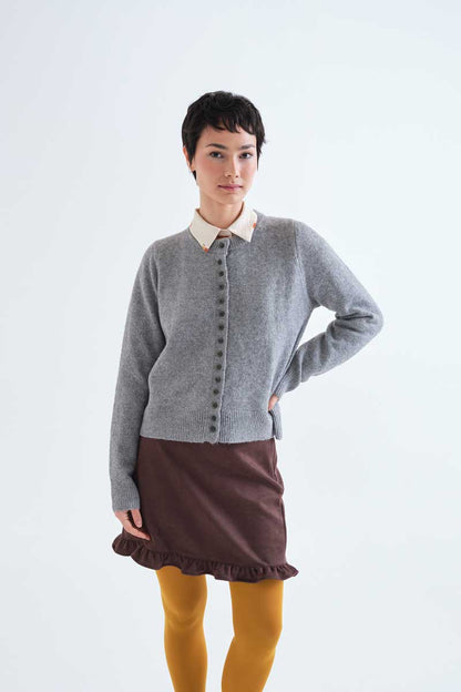 Light grey cardigan with black buttons