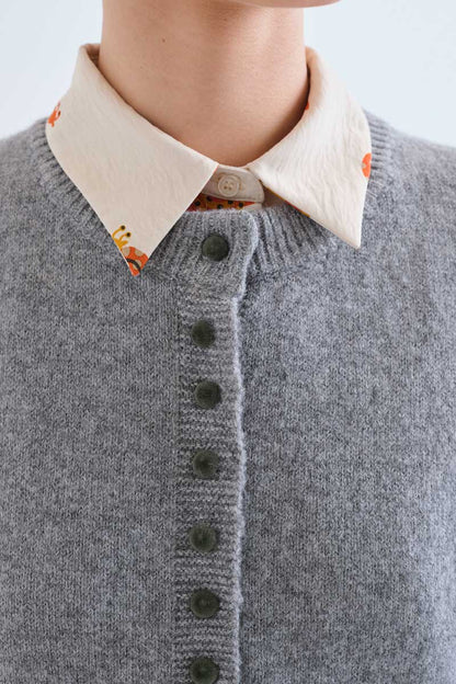 Light grey cardigan with black buttons
