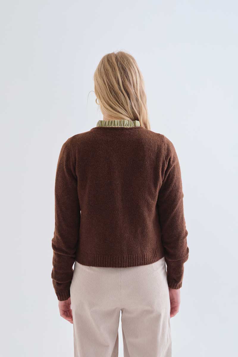Brown cardigan with red heart buttons