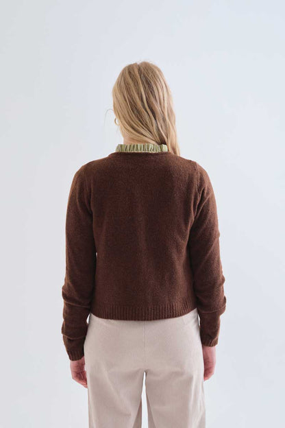 Brown cardigan with red heart buttons