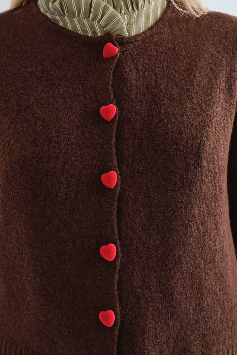 Brown cardigan with red heart buttons