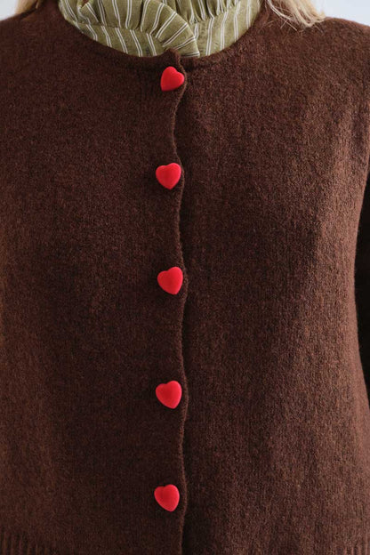 Brown cardigan with red heart buttons