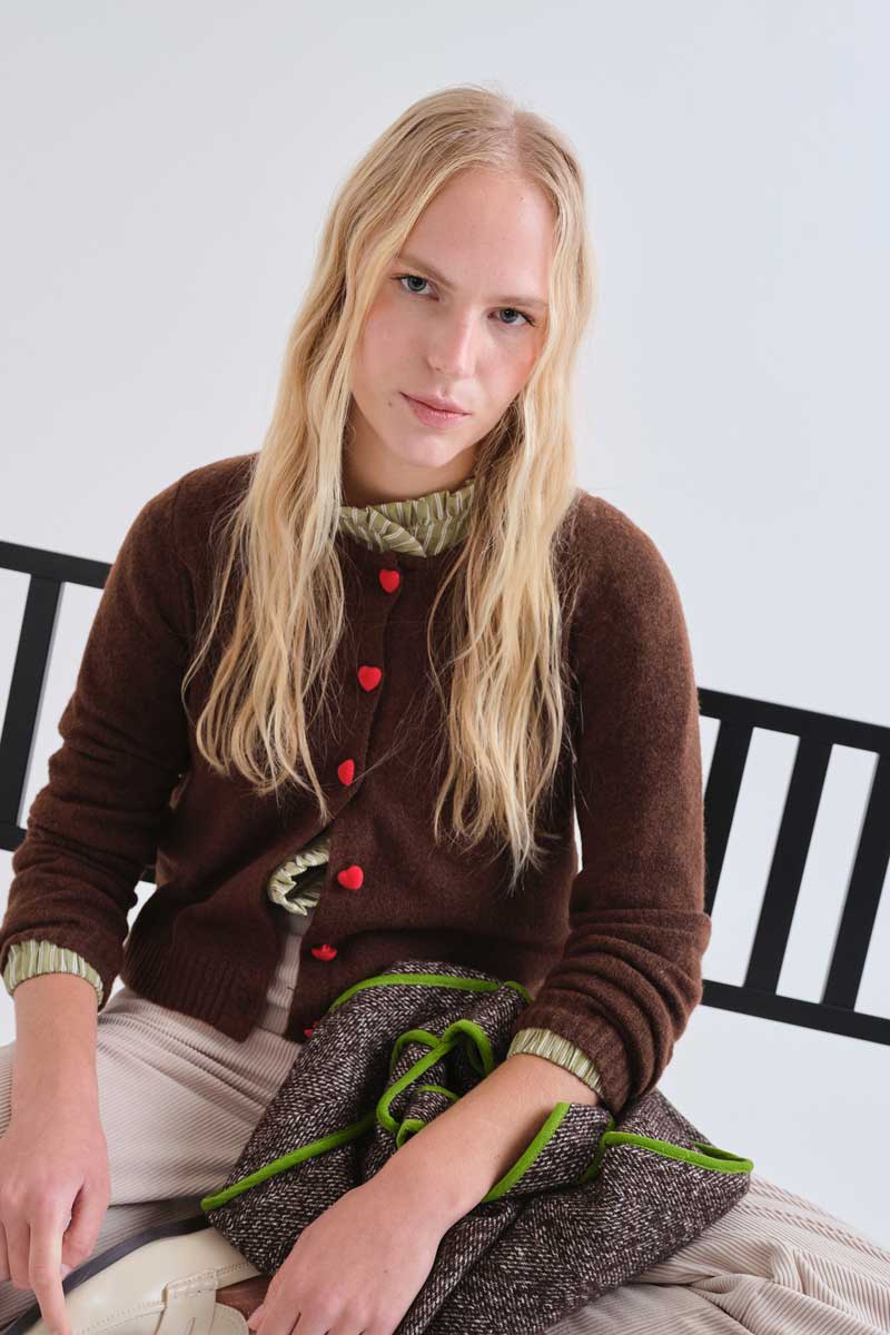 Brown cardigan with red heart buttons