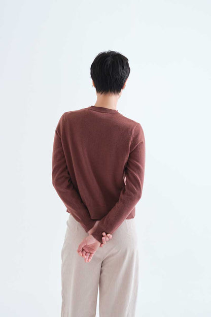 Brown knit cardigan with floral buttons