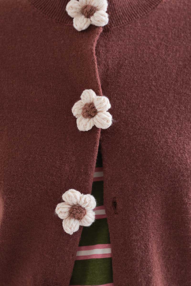 Brown knit cardigan with floral buttons