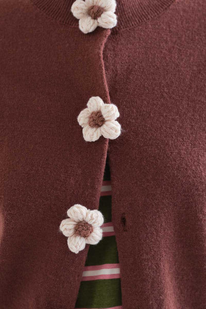 Brown knit cardigan with floral buttons