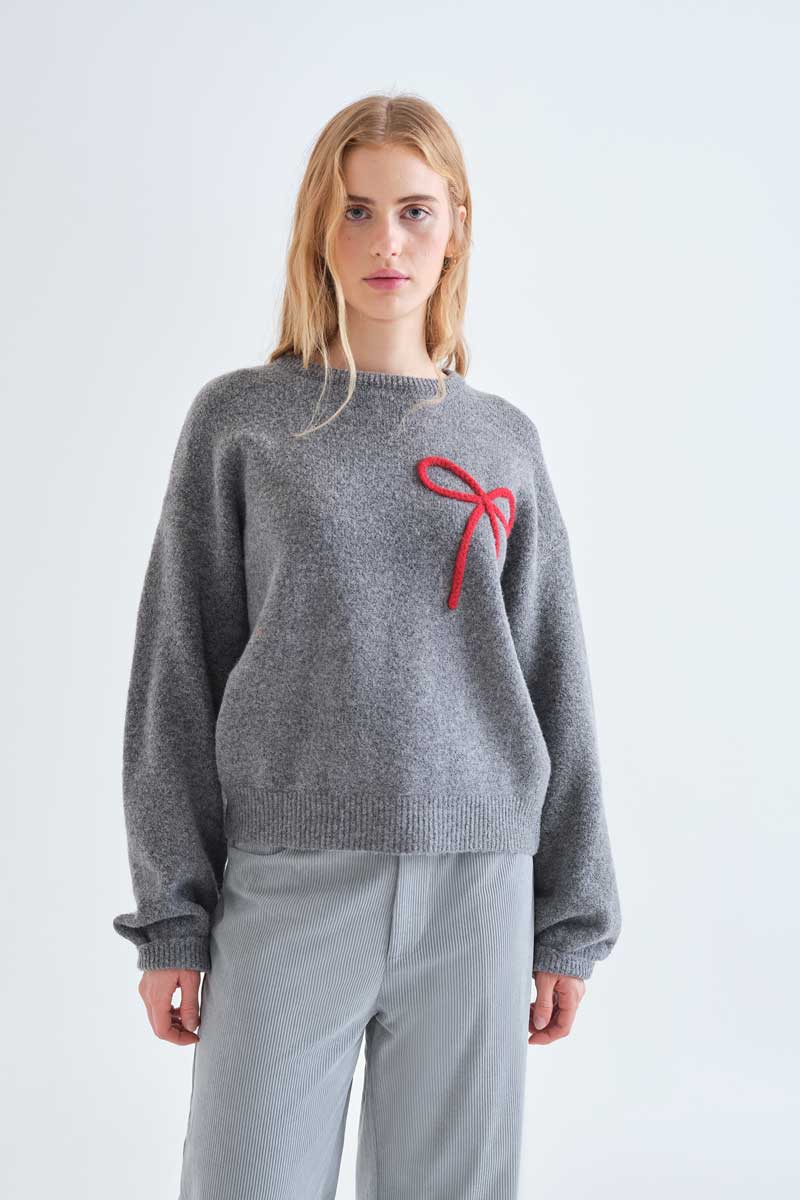Grey knit jumper with red bow detail