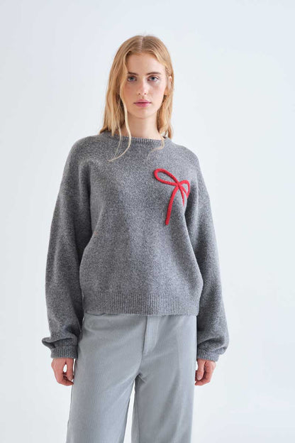 Grey knit jumper with red bow detail