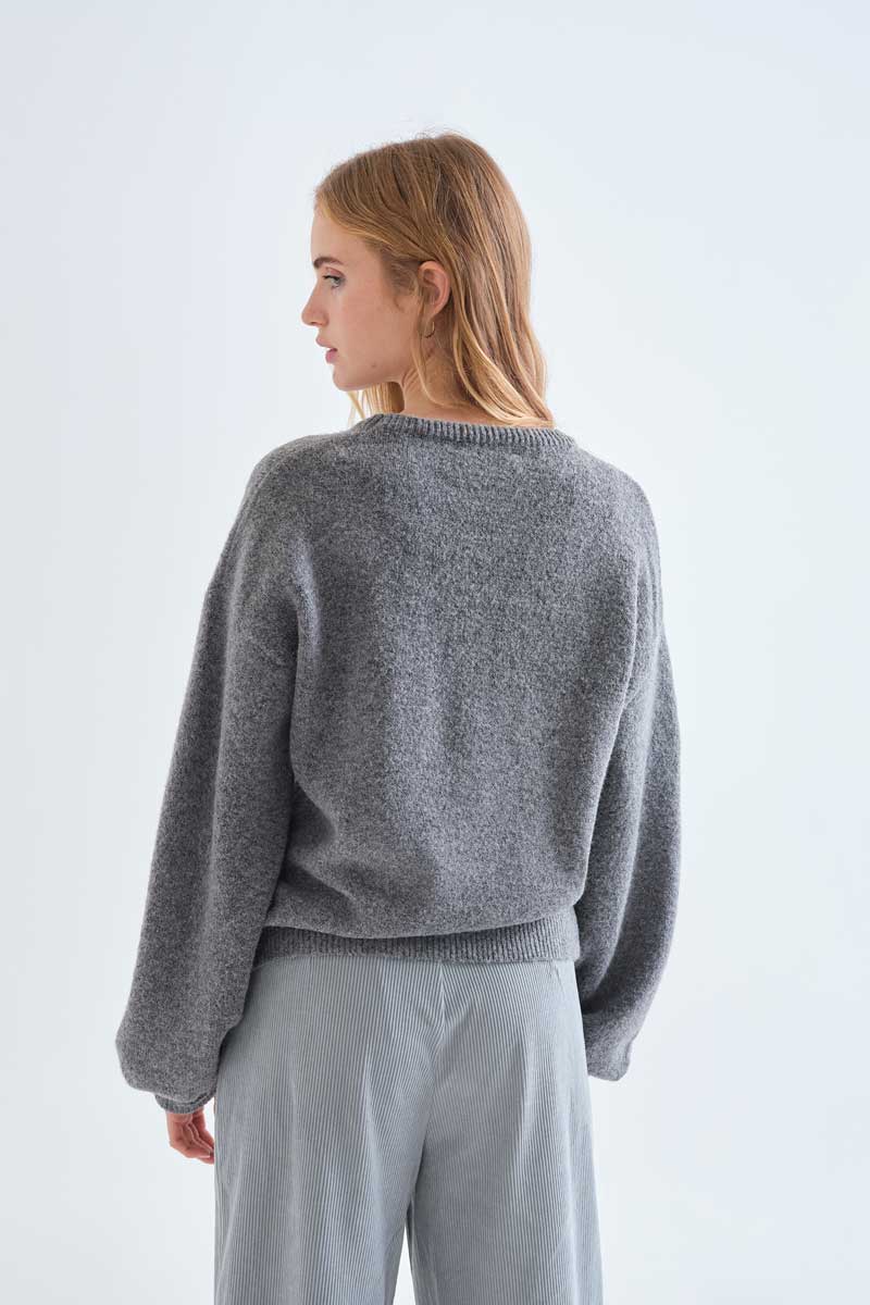 Grey knit jumper with red bow detail