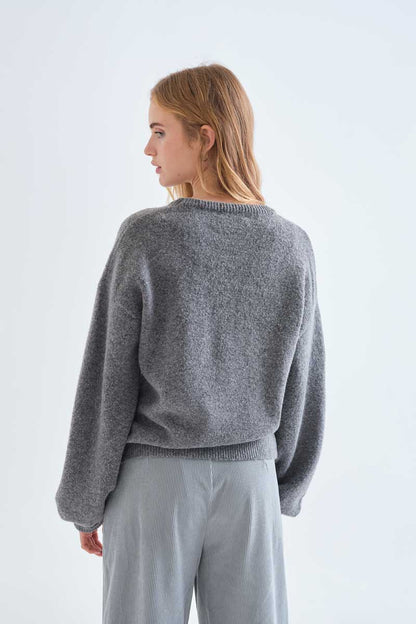 Grey knit jumper with red bow detail