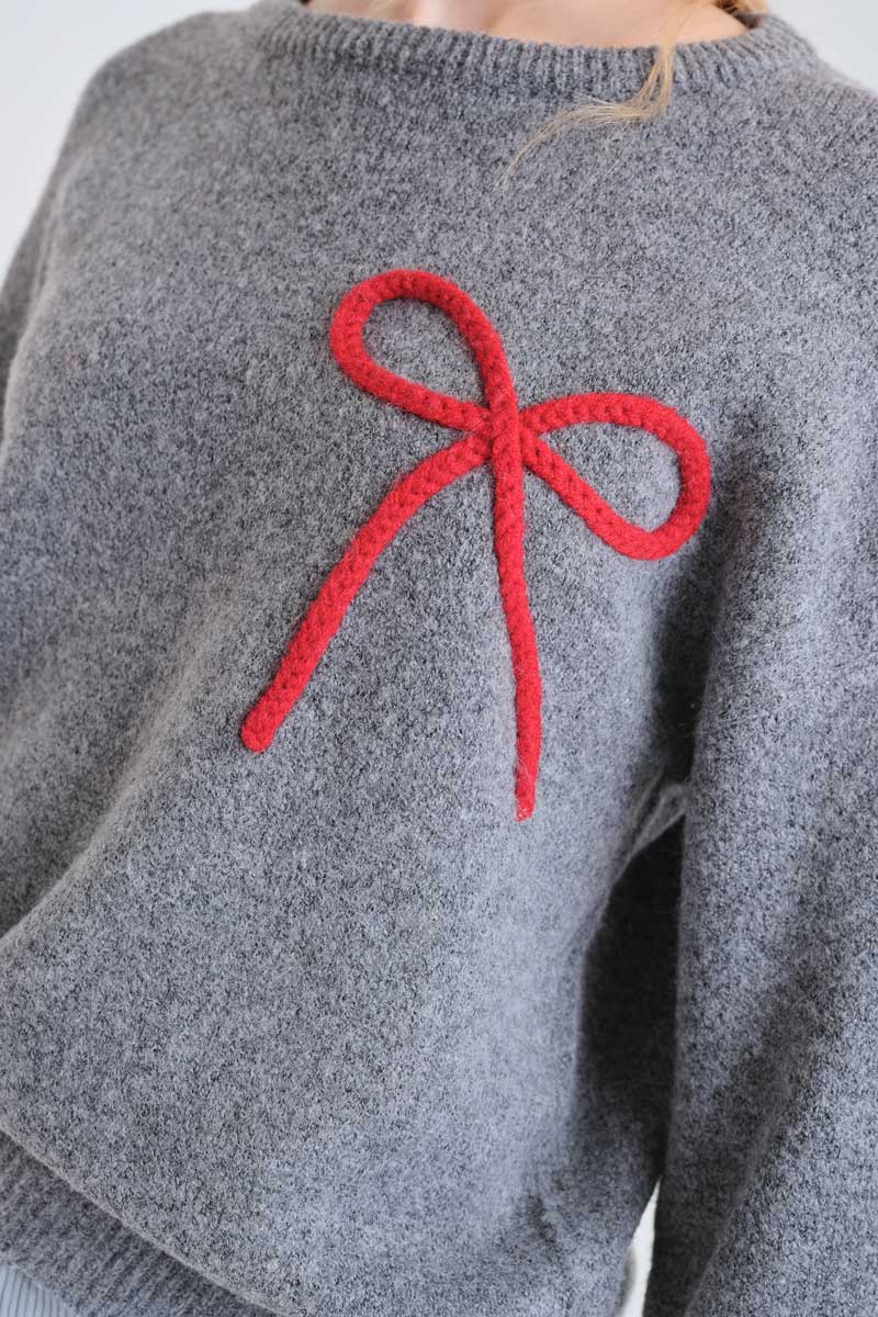 Grey knit jumper with red bow detail