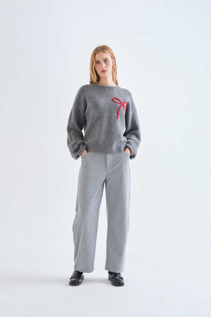 Grey knit jumper with red bow detail