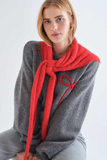 Grey knit jumper with red bow detail