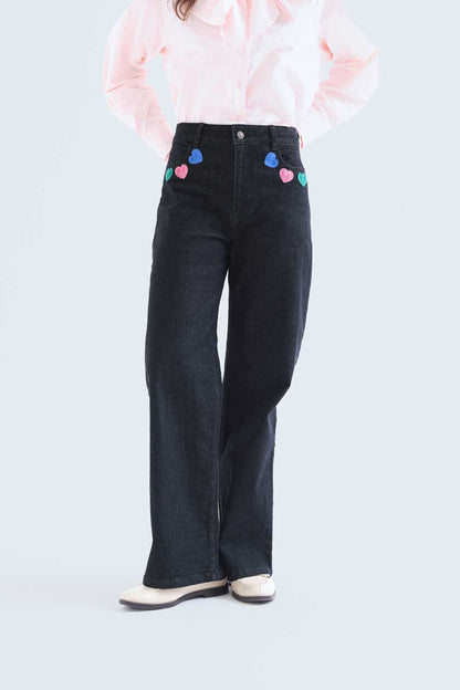 Black denim trousers with Candy print